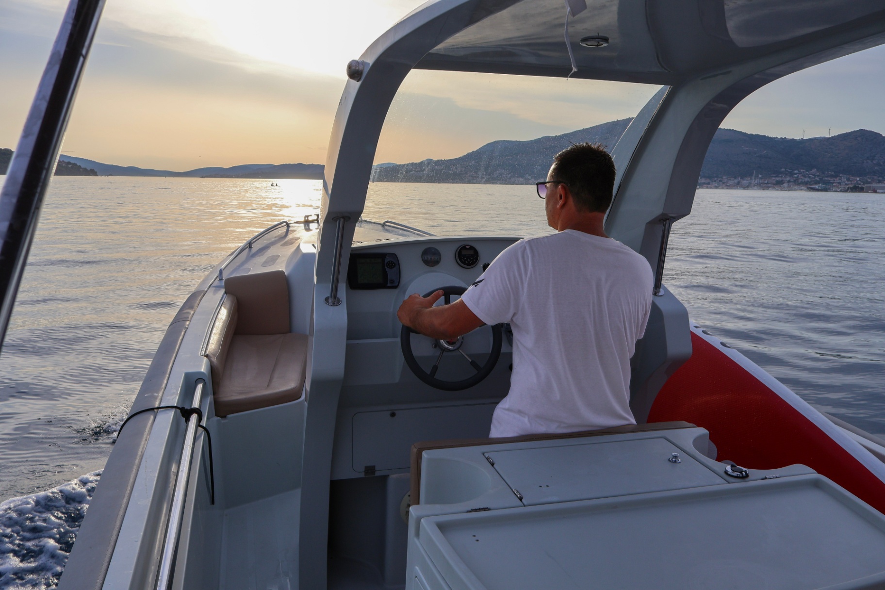 Skipper Damir at the helm cruising into the Dalmatian sunset