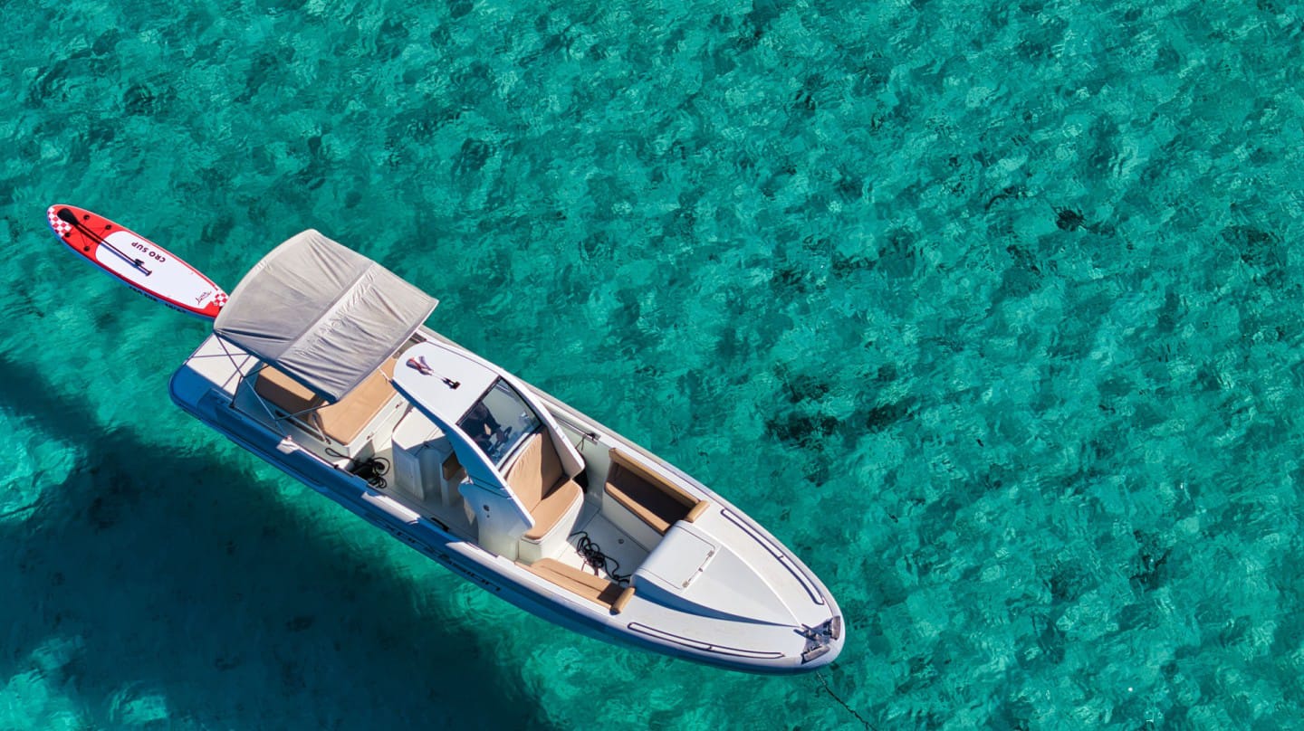 Top-down view of the boat's shaded cockpit and sun beds