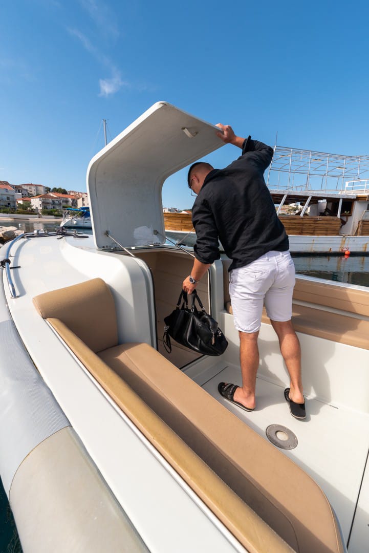 Spacious bow locker and sand-coloured upholstery on the Expression speedboat